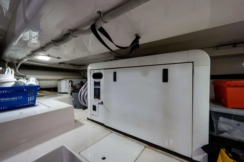 Slide: The Image of Engine room of a 2008 Bertram 570 yacht with storage and equipment. - 66