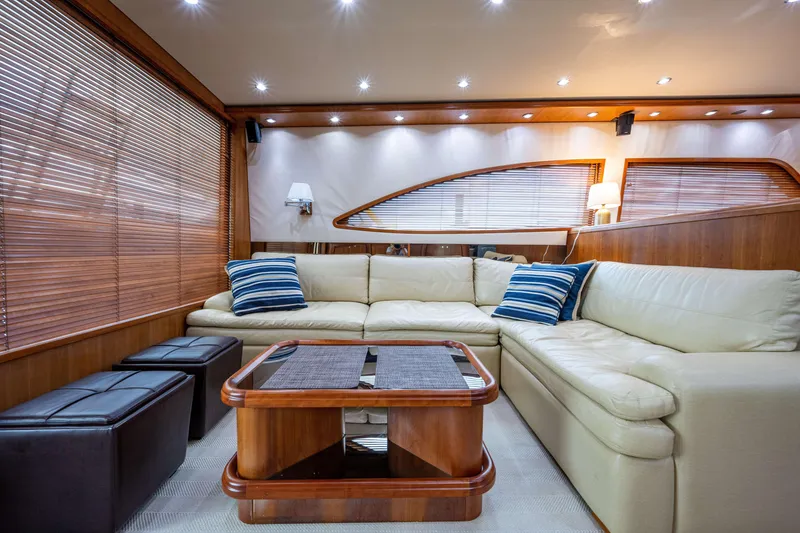 Slide: The Image of Luxurious interior of 2008 Bertram 570 yacht with cream sofa and wooden accents. - 27