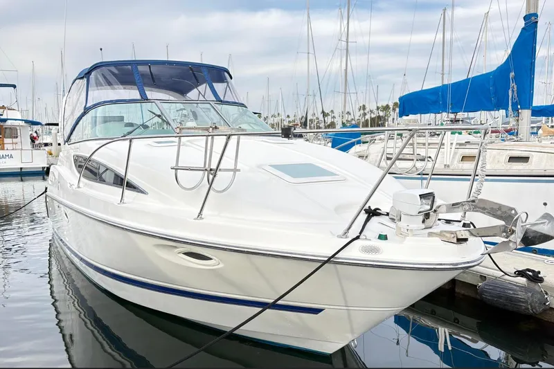 The Image of 2007 Bayliner 285 boat docked in marina, surrounded by sailboats. - 0