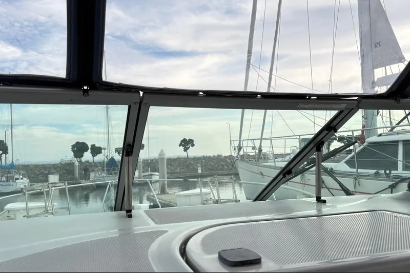 Slide: The Image of View from 2007 Bayliner 285 boat cockpit overlooking marina with sailboats and trees. - 10