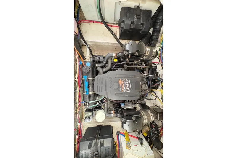 Slide: The Image of Engine compartment of a 2007 Bayliner 285 boat, featuring a MerCruiser 350 engine. - 18