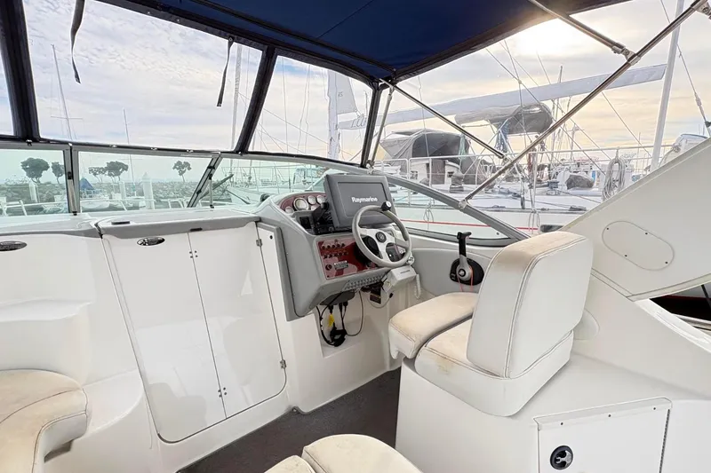 Slide: The Image of Interior view of a 2007 Bayliner 285 boat cockpit with steering wheel and navigation system. - 7