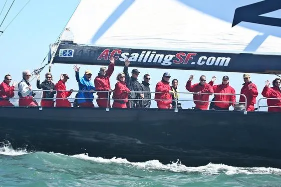 Slide: The Image of Group sailing on 2002 Custom International Americas Cup Class yacht, ACsailingSF.com, in open waters. - 31