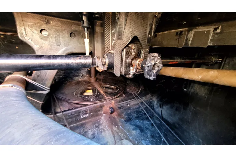 Slide: The Image of Interior view of a 2002 Custom International Americas Cup Class yacht, showcasing mechanical components. - 38