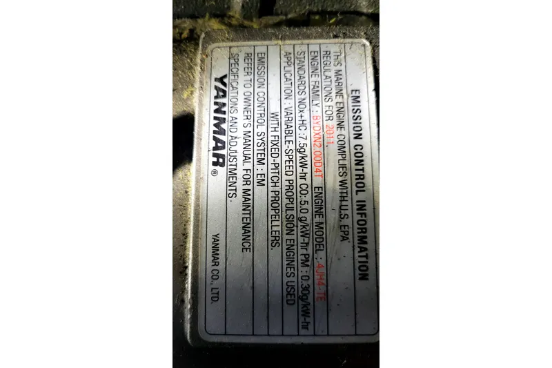 Slide: The Image of Yanmar engine emission control label, model 4JH4-TE, compliance details, 2002 International Americas Cup Class. - 47