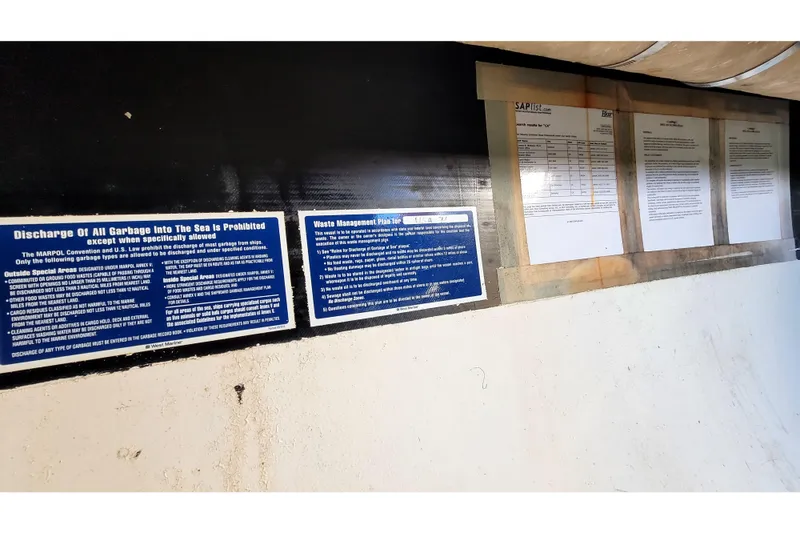 Slide: The Image of Notices and documents on a 2002 Custom International Americas Cup Class yacht. - 58