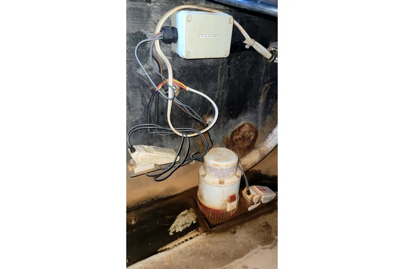 Slide: The Image of Wiring and pump system inside a 2002 Custom International Americas Cup Class boat. - 68