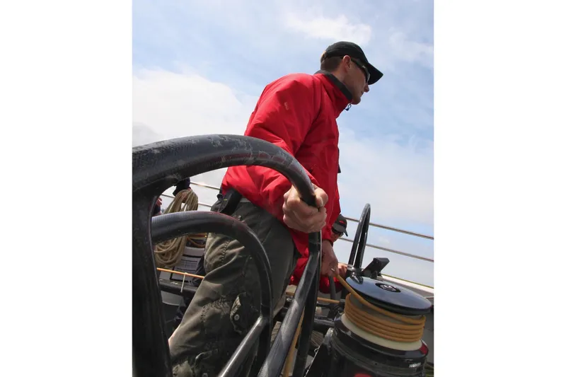 Slide: The Image of Person steering a 2002 Custom International Americas Cup Class yacht. - 7