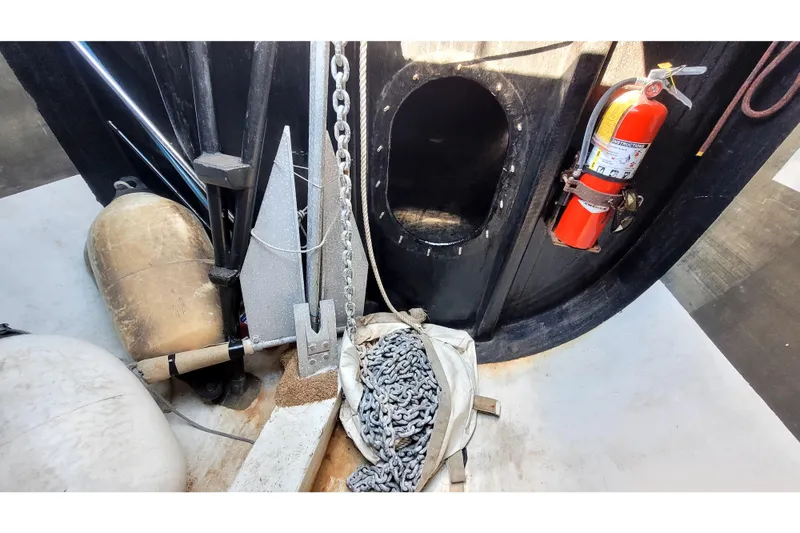 Slide: The Image of Interior of a 2002 Custom International Americas Cup Class yacht with anchor and fire extinguisher. - 74