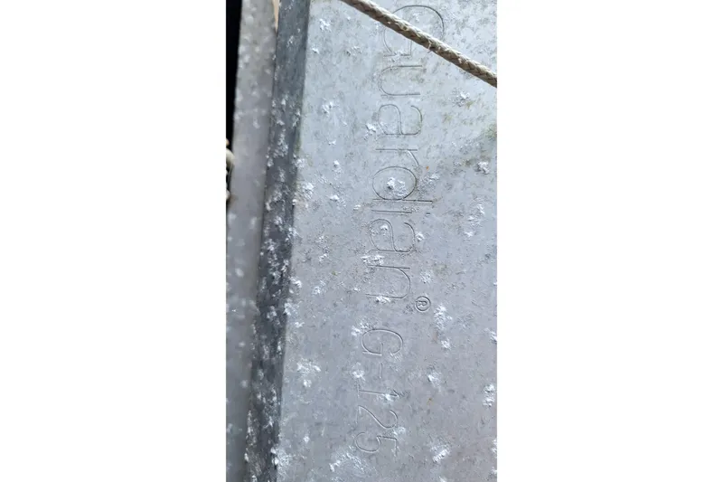 Slide: The Image of Close-up of textured metal surface with "Guardian G-125" engraving. - 75