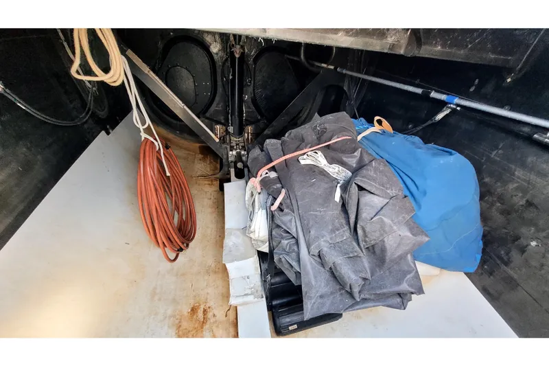 Slide: The Image of Interior of a 2002 Custom International Americas Cup Class yacht with ropes and sails. - 77