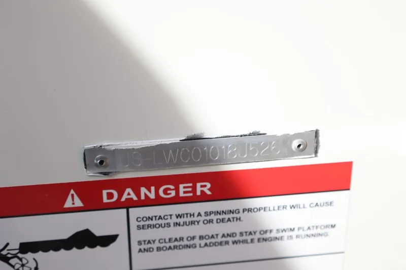 Slide: The Image of 2026 Lowe Fishing Machine 1675 WT warning label and serial number plate. - 16