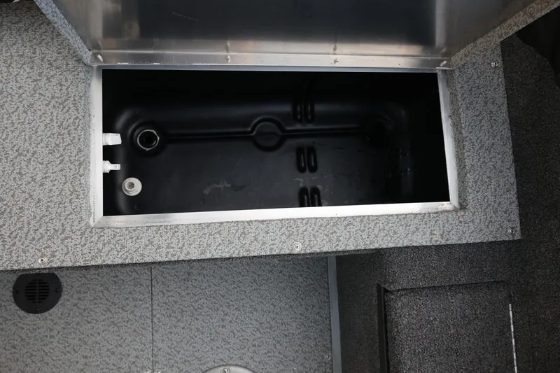 Slide: The Image of 2026 Lowe Fishing Machine 1675 WT livewell compartment, featuring durable interior design. - 34