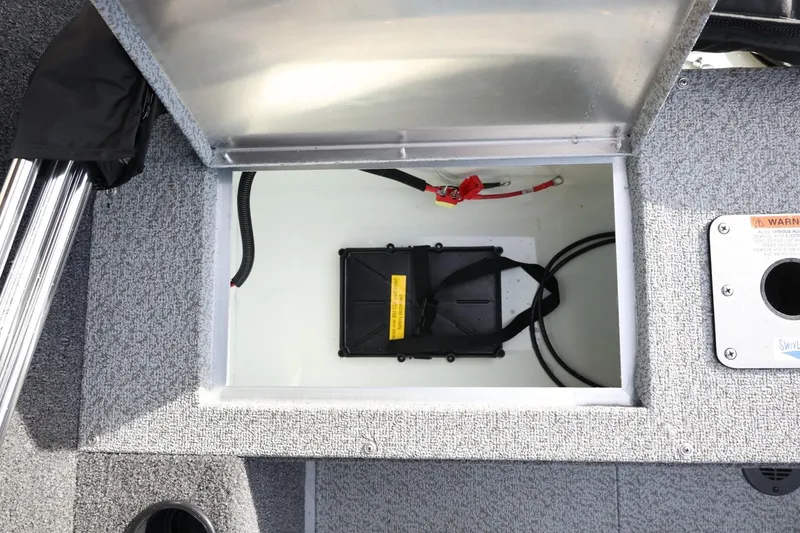 Slide: The Image of Open storage compartment in 2026 Lowe Fishing Machine 1675 WT boat. - 35