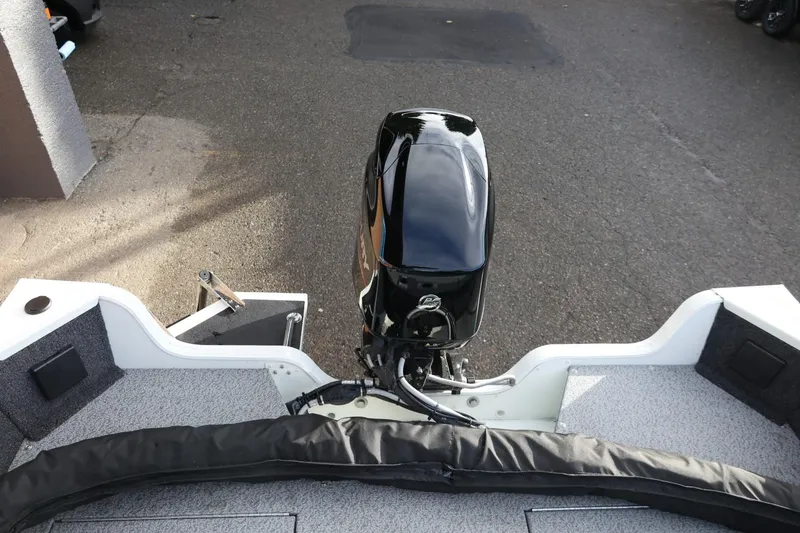 Slide: The Image of 2026 Lowe Fishing Machine 1675 WT boat with a sleek outboard motor. - 36