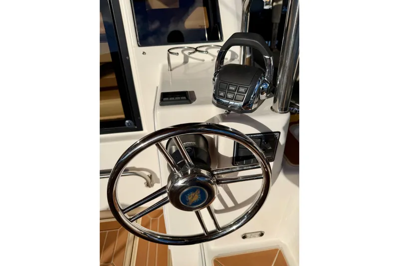 Slide: The Image of Steering wheel and controls of 2018 Ranger Tugs R-29 CB boat. - 11