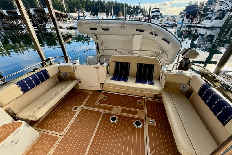 Slide: The Image of 2018 Ranger Tugs R-29 CB boat interior with seating, docked at marina. - 13