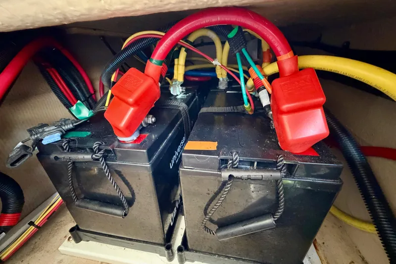 Slide: The Image of 2018 Ranger Tugs R-29 CB boat batteries with red and yellow cables connected. - 17