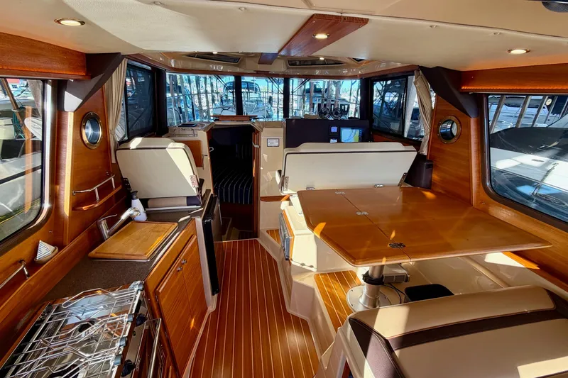 Slide: The Image of 2018 Ranger Tugs R-29 CB interior with wood finishes and modern amenities. - 33