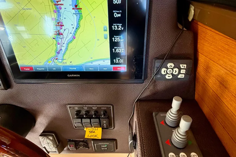 Slide: The Image of 2018 Ranger Tugs R-29 CB helm with Garmin navigation display and control panel. - 38