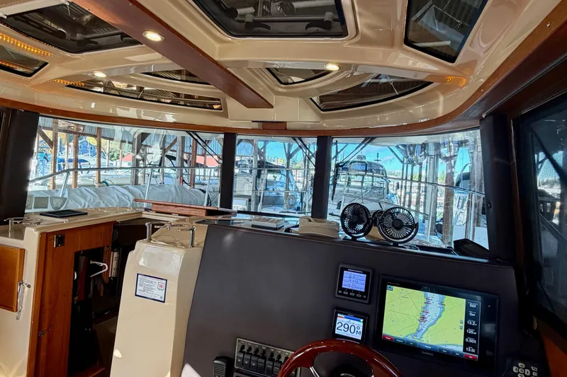 Slide: The Image of Interior view of 2018 Ranger Tugs R-29 CB boat with navigation equipment and panoramic windows. - 40
