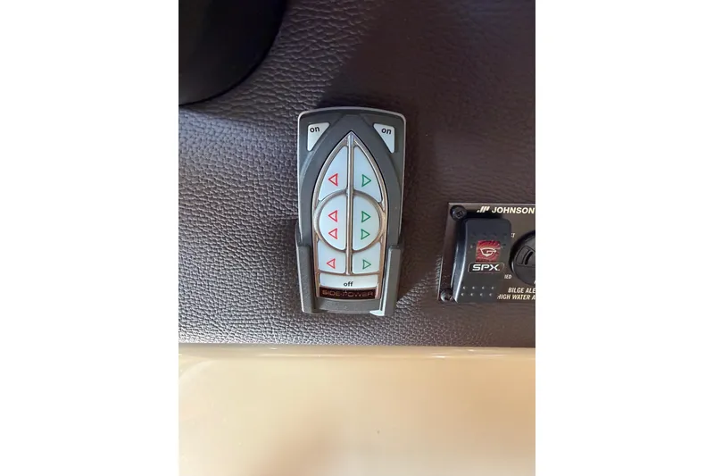 Slide: The Image of Control panel on 2018 Ranger Tugs R-29 CB boat dashboard with buttons and switches. - 41