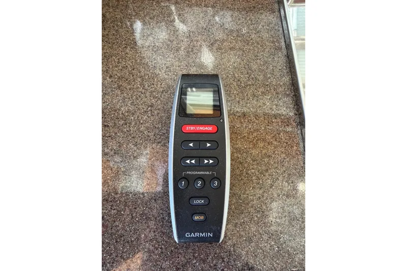 Slide: The Image of Garmin remote control on a Ranger Tugs R-29 CB, 2018 model, granite surface. - 42
