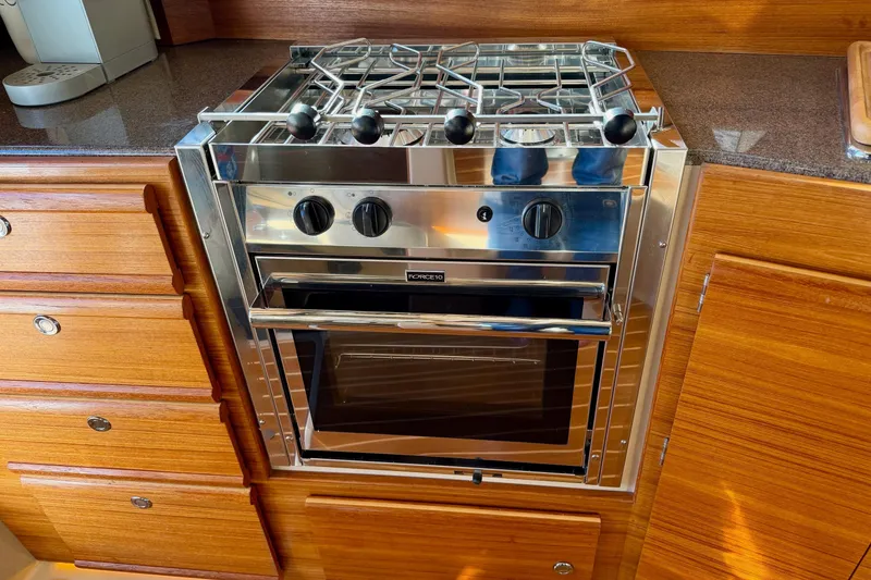 Slide: The Image of Stainless steel oven in 2018 Ranger Tugs R-29 CB boat kitchen. - 44