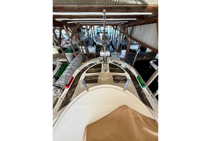 Slide: The Image of 2018 Ranger Tugs R-29 CB boat docked in a covered marina. - 59