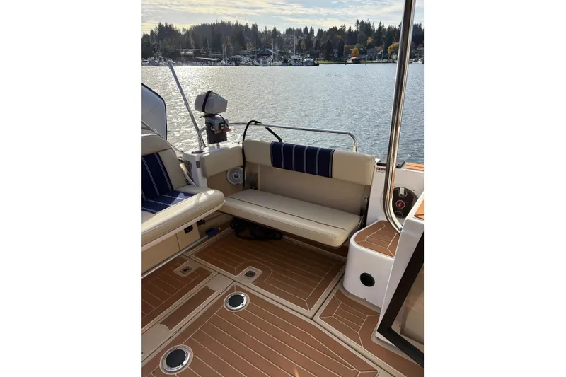 Slide: The Image of 2018 Ranger Tugs R-29 CB boat interior with seating and scenic water view. - 66