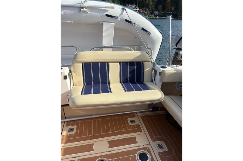 Slide: The Image of 2018 Ranger Tugs R-29 CB boat with striped seating and teak-style flooring. - 67