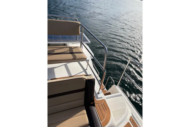 Slide: The Image of 2018 Ranger Tugs R-29 CB boat deck with seating, overlooking water. - 73