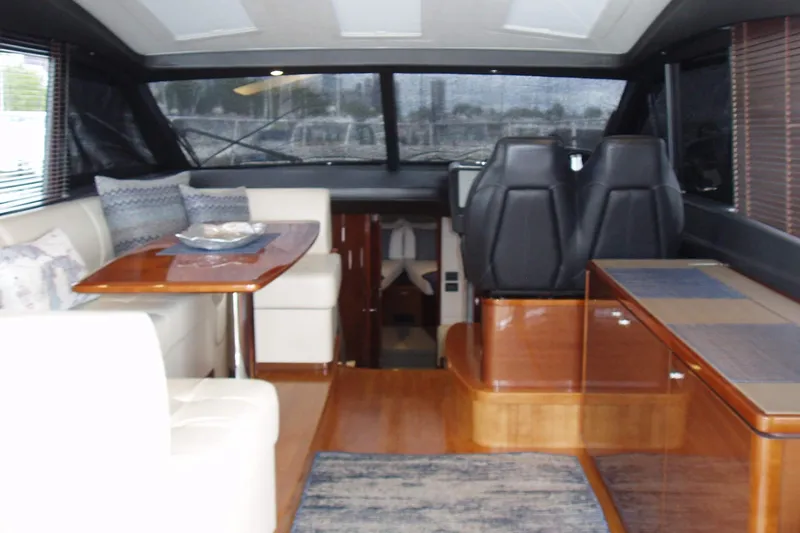Slide: The Image of Luxurious interior of 2015 Princess V48 yacht with elegant seating and dining area. - 17