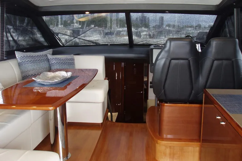 Slide: The Image of Luxurious interior of 2015 Princess V48 yacht with elegant seating and dining area. - 18
