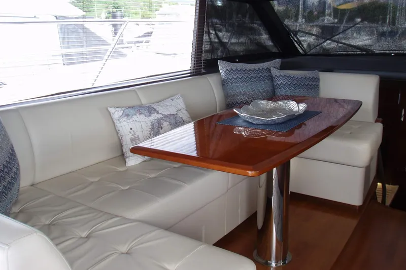 Slide: The Image of Luxurious interior of 2015 Princess V48 yacht with elegant seating and wooden table. - 19