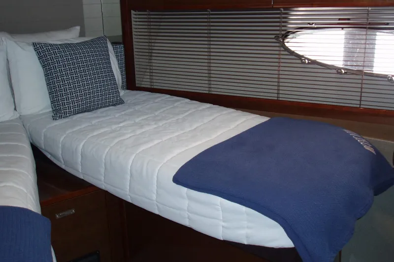 Slide: The Image of Luxurious cabin interior of 2015 Princess V48 yacht with cozy bedding. - 26