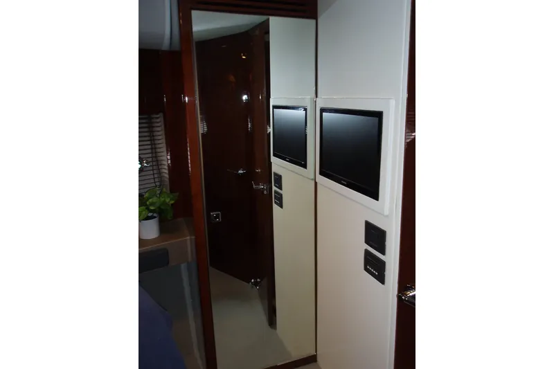 Slide: The Image of Interior of 2015 Princess V48 yacht with TV and mirror. - 28