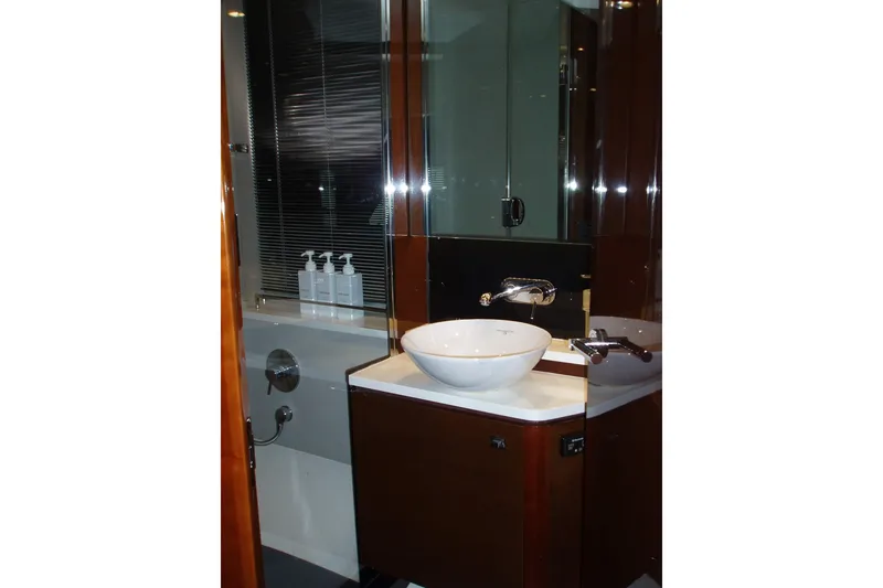 Slide: The Image of Luxurious bathroom in 2015 Princess V48 yacht with modern fixtures and elegant design. - 36