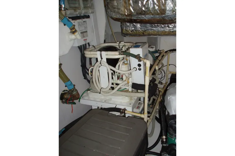 Slide: The Image of Engine room of 2015 Princess V48 yacht with complex piping and machinery. - 38