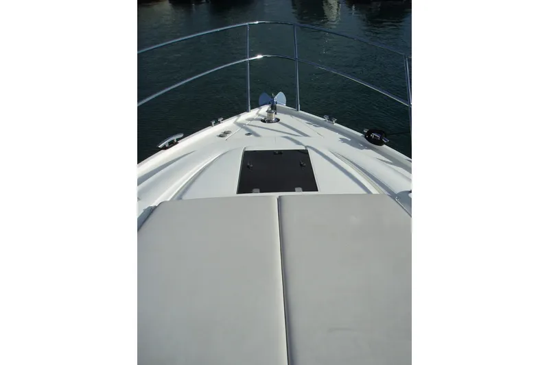 Slide: The Image of Bow view of 2015 Princess V48 yacht with sunpad and railing. - 9