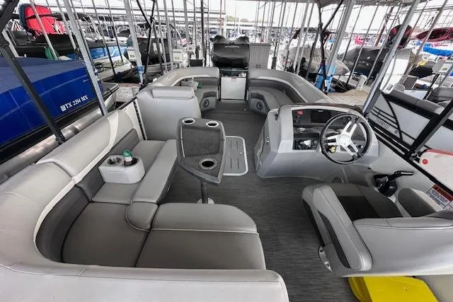 Slide: The Image of 2023 Bennington SX 21 Fishing boat interior with seating and steering console. - 10