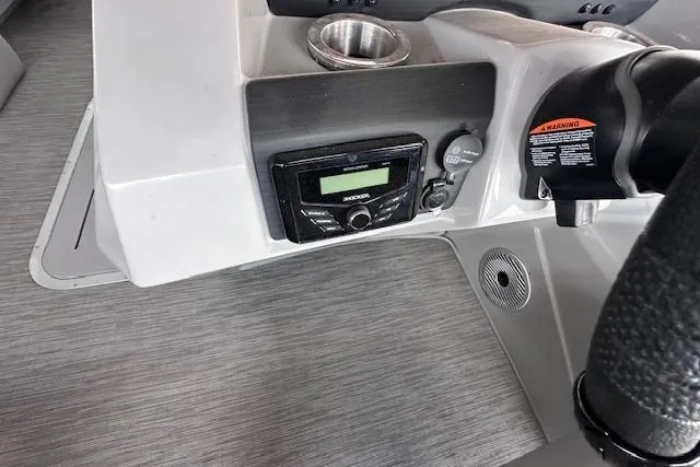 Slide: The Image of 2023 Bennington SX 21 Fishing boat dashboard with stereo and controls. - 11