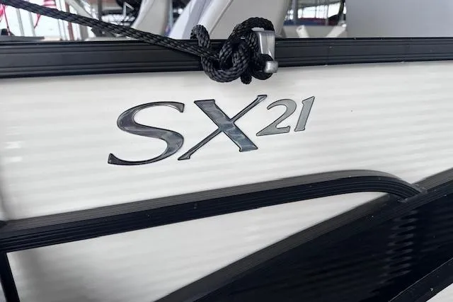 Slide: The Image of 2023 Bennington SX 21 Fishing boat logo on white exterior. - 16