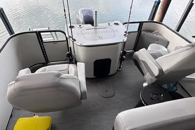 Slide: The Image of 2023 Bennington SX 21 Fishing boat interior with seating and fishing setup. - 6