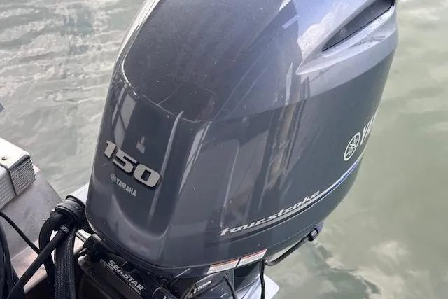 Slide: The Image of Yamaha 150 four-stroke outboard motor on 2023 Bennington SX 21 Fishing boat. - 7