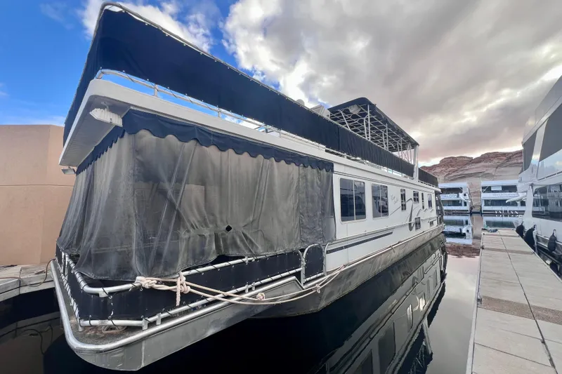The Image of 2007 Lakeview 62 HD houseboat docked under cloudy sky. - 1
