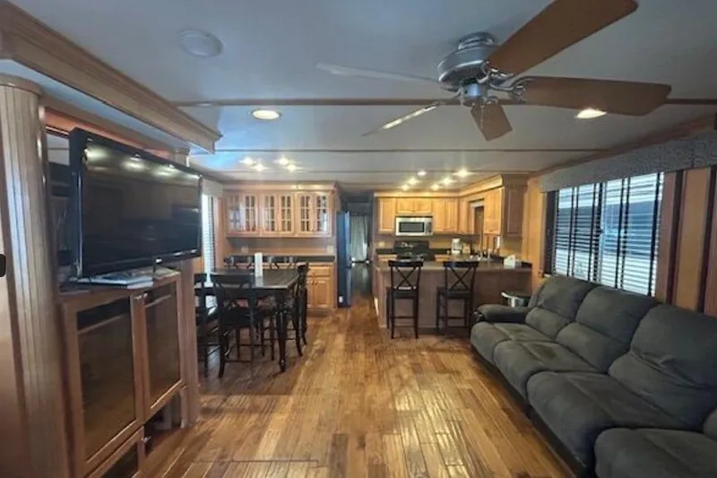 Slide: The Image of Luxurious 2007 Sumerset Lakeview HD houseboat interior with modern kitchen and cozy living area. - 12