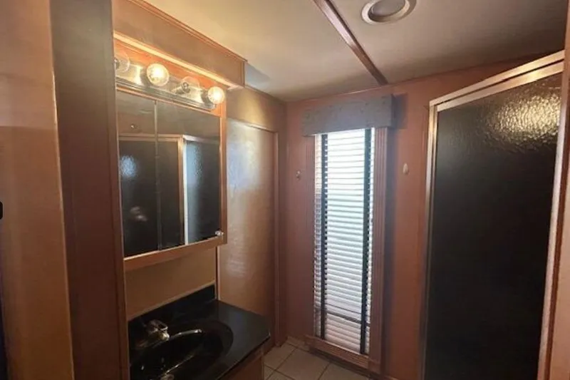 Slide: The Image of 2007 Sumerset Lakeview HD bathroom with mirror, sink, and shower. - 20