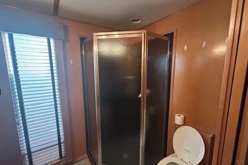 Slide: The Image of Bathroom interior of 2007 Sumerset Lakeview HD houseboat with shower and toilet. - 22