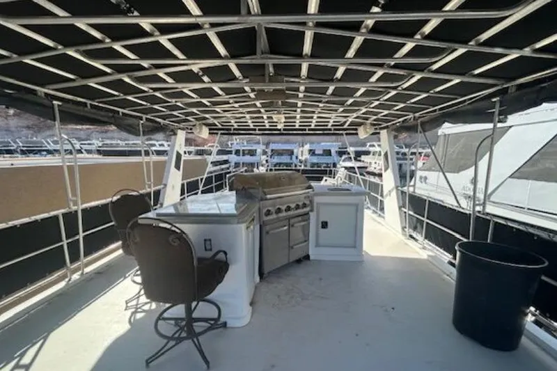 Slide: The Image of 2007 Sumerset Lakeview HD houseboat deck with grill and seating area. - 33